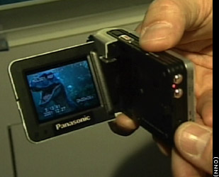 Panasonic SV-AV10 e-wear SD A/V Recorder - The Panasonic SV-AV10 e-wear SD A/V Recorder combines nearly every digital audio and video toy into a single hand-held device. The SD-AV10 includes a digital camcorder, still camera, audio player, and voice recorder. An optional printer even allows users to print photos directly from the device.
