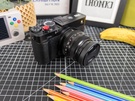 Nabewerkte foto's buiten accordion - compactcamera vs. smartphone